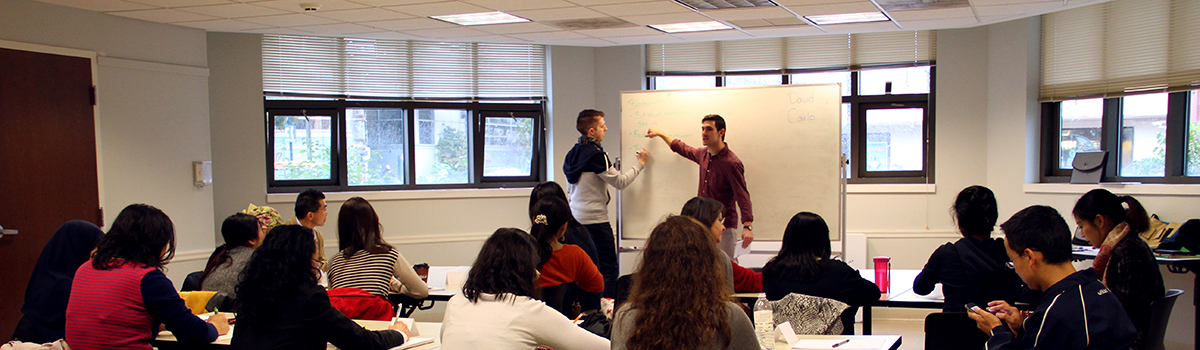 Students sitting in class asking questions